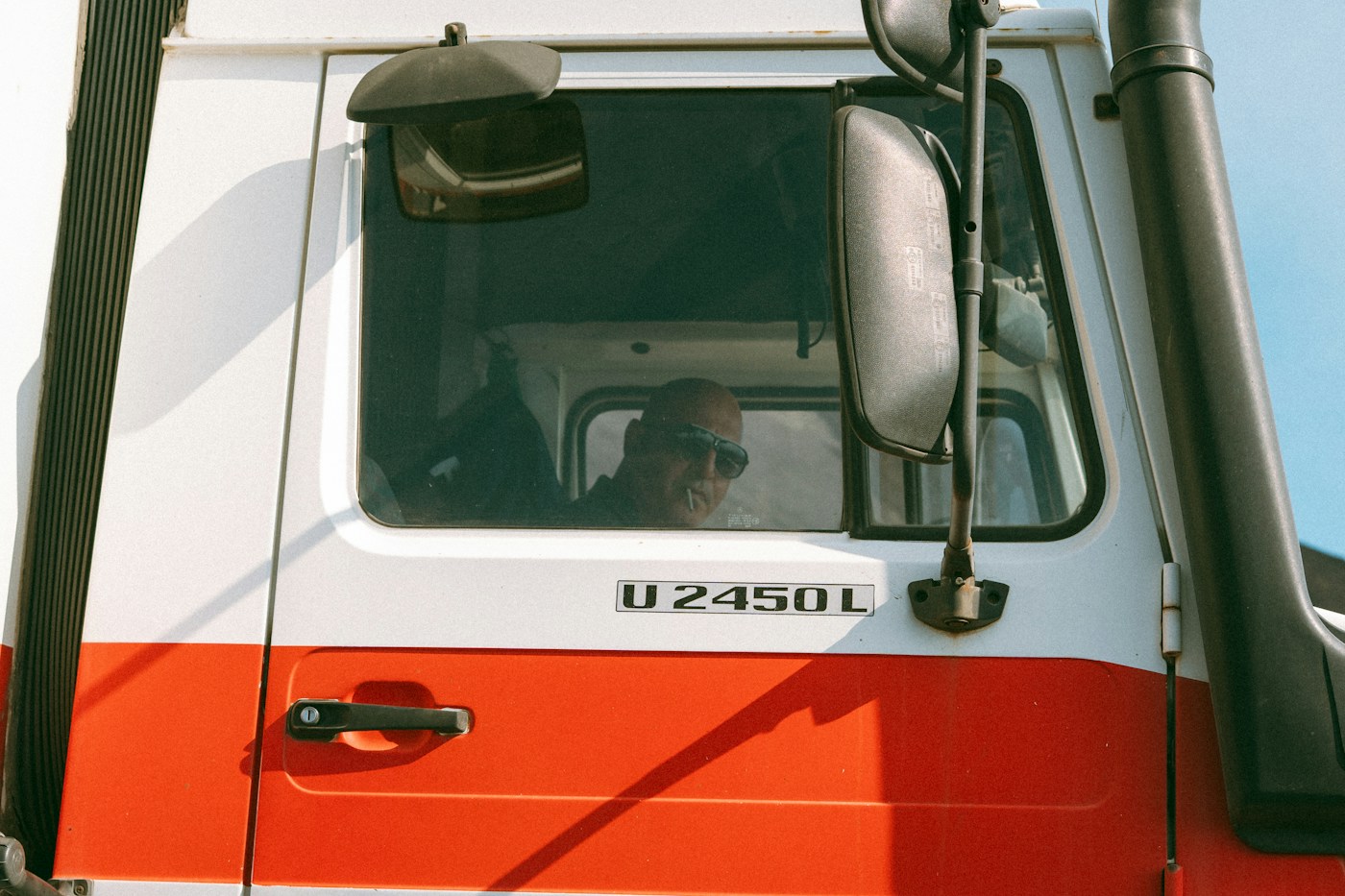Driver seated in a commercial truck cab