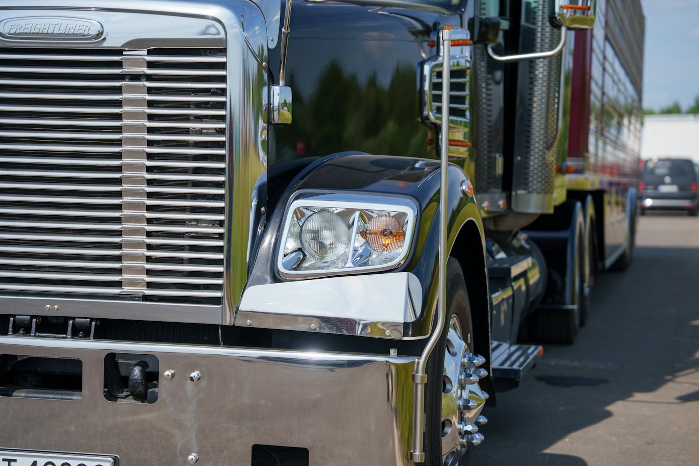 Close-up of a semi-truck and its front wheel